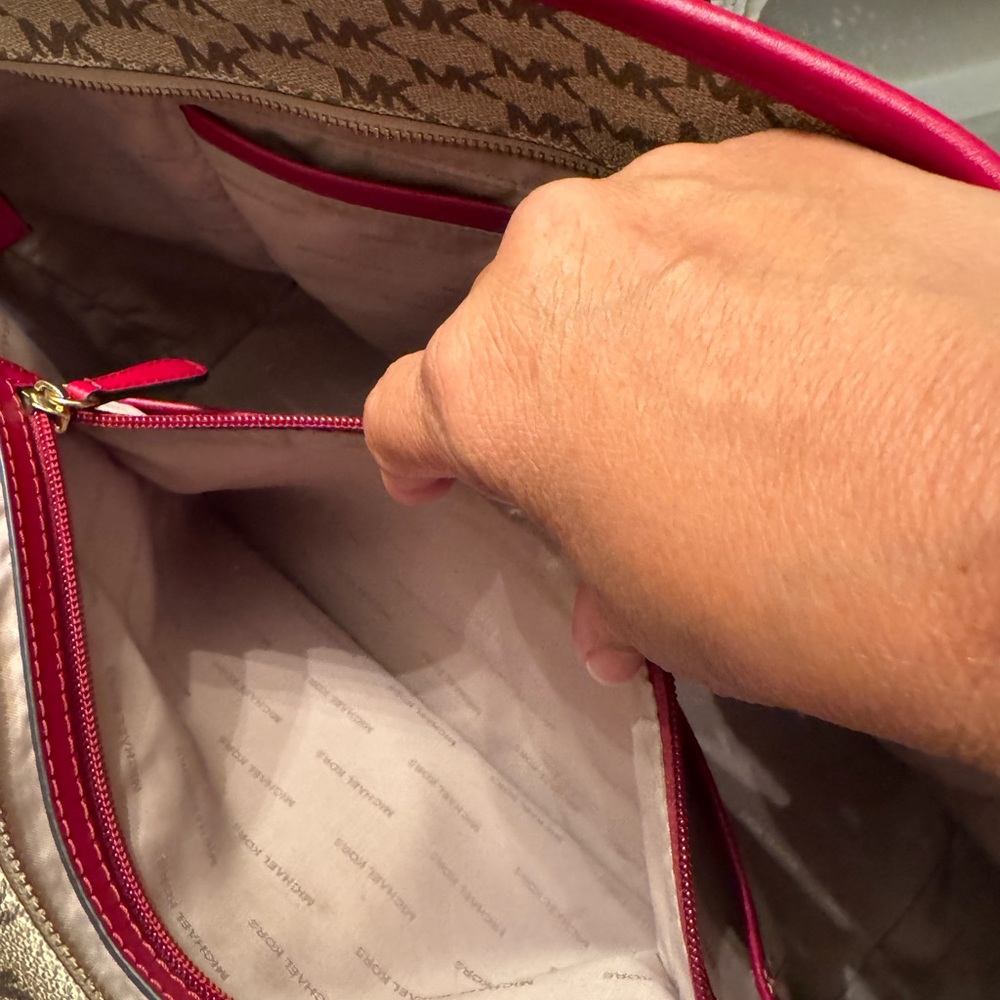 Michael Kors tote 19 length 11 wide zippered closures outside and out. 3 inside - Picture 10 of 11